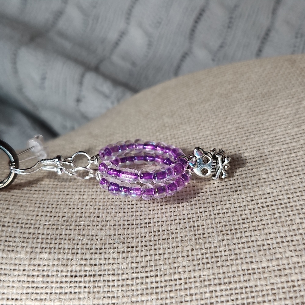 Handmade Purple Seed Beads w/ Silver Colored Skull/ Crossbones Charms